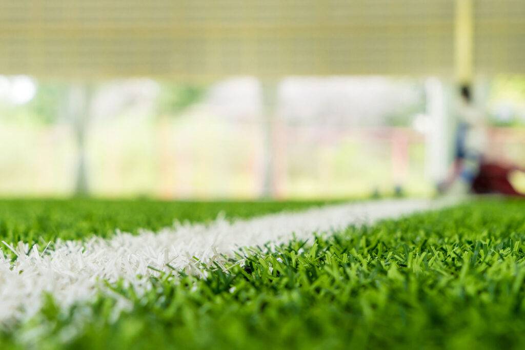 contacto cesped futbol